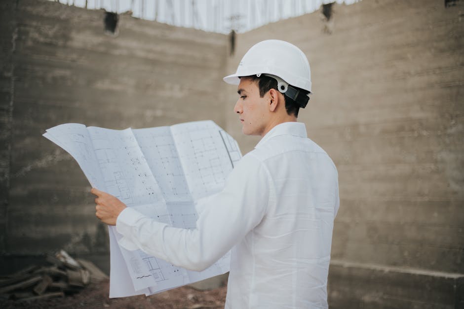 General contractor reviewing home renovation blueprints
